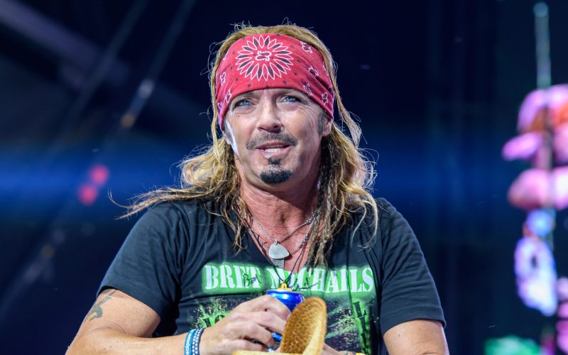 Bret Michaels performing live on stage during a classic rock concert